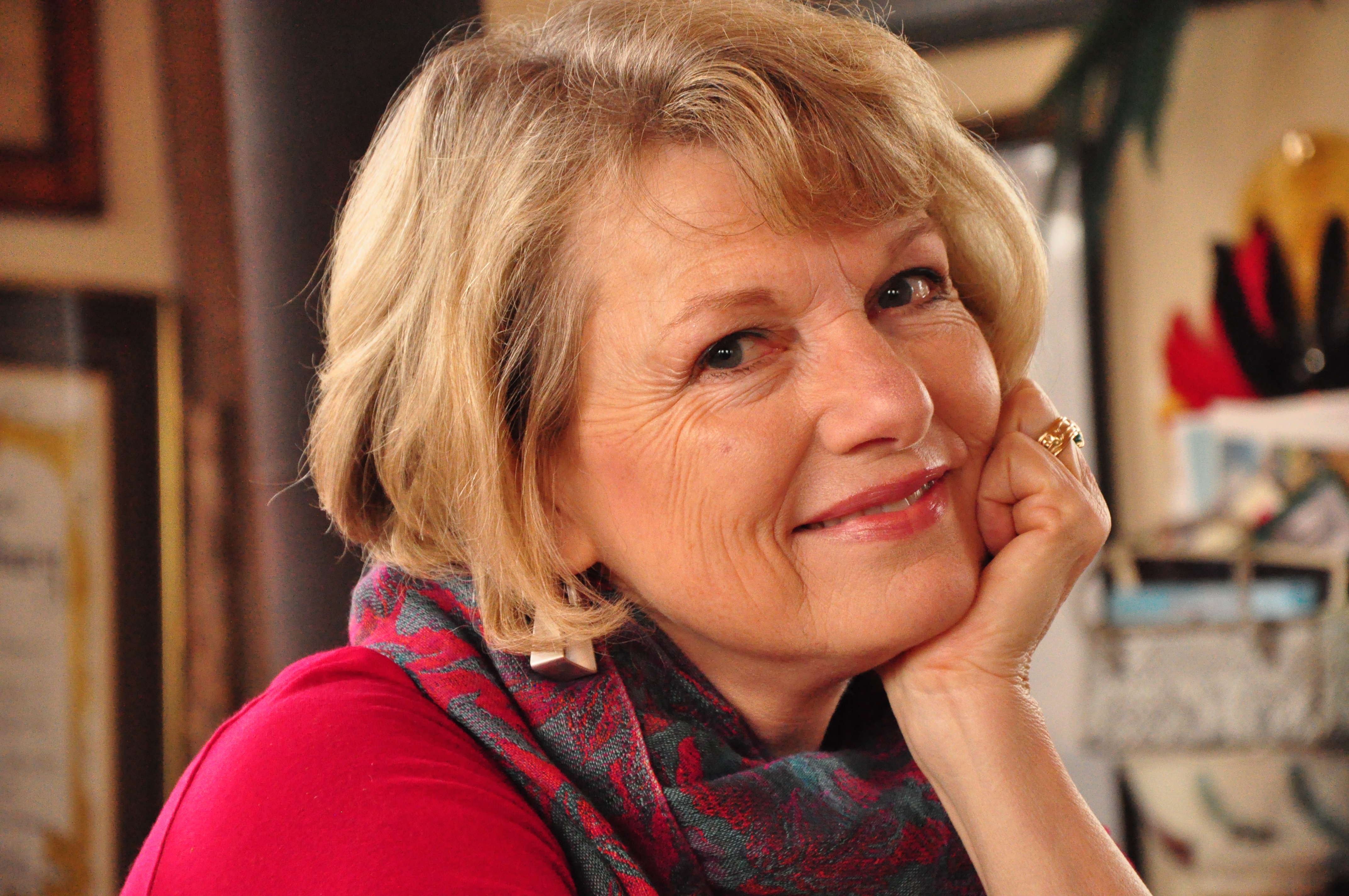 Woman sitting with chin on hand